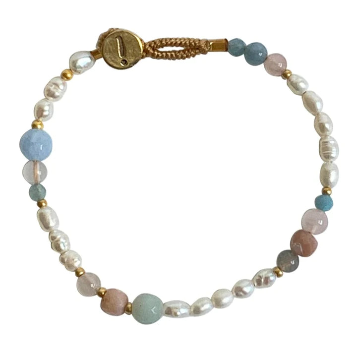 Your new season essential bracelet made out of different semi-precious stones and freshwater pearls.