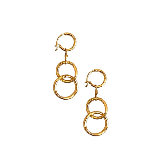 Sparkle and shine with our effortlessly chic drop circle earrings by IBU. From day to night, drop earrings are versatile for any occasion. Ours are handmade and plated in gold.