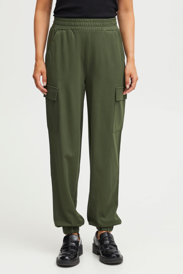 A great cargo style pant by Scandi brand Fransa. A pull on trouser with a fully elasticated waist. They are a high rise and have an elasticated ankle. There are large patch style pockets on the side of each leg making it military style. There are also slanted pockets at the front.