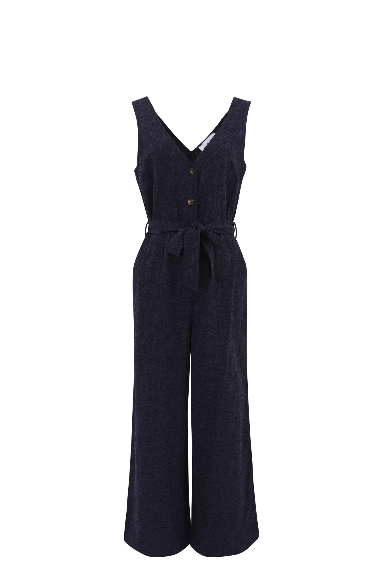 A beautiful summer jumpsuit in a fabulous embossed fabric from FRNCH. The perfect piece for a summer wedding or worn casually with trainers. The V neck is front and back so very elegant . It buttons from the V to the waist with large contrasting buttons and has a tie belt. There are patch pockets to the front. The fit is true to size. It is a wide leg piece. Fabric is an embossed floral print.
