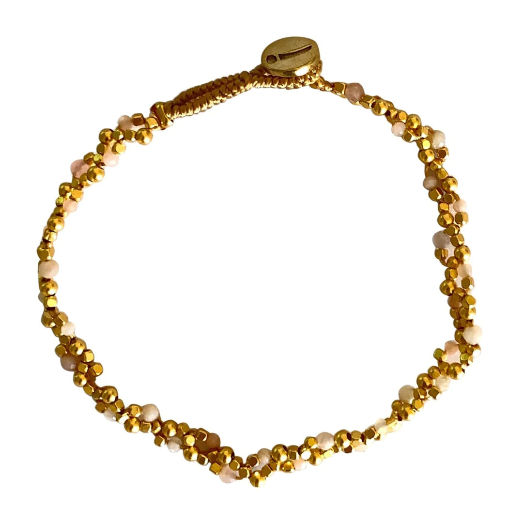 Our best seller from IBU ! A fine openwork bracelet with a delicate feminine look. This beautiful bracelet is handmade with a special technique by our talented artisans and comes in gold with semi precious stones.