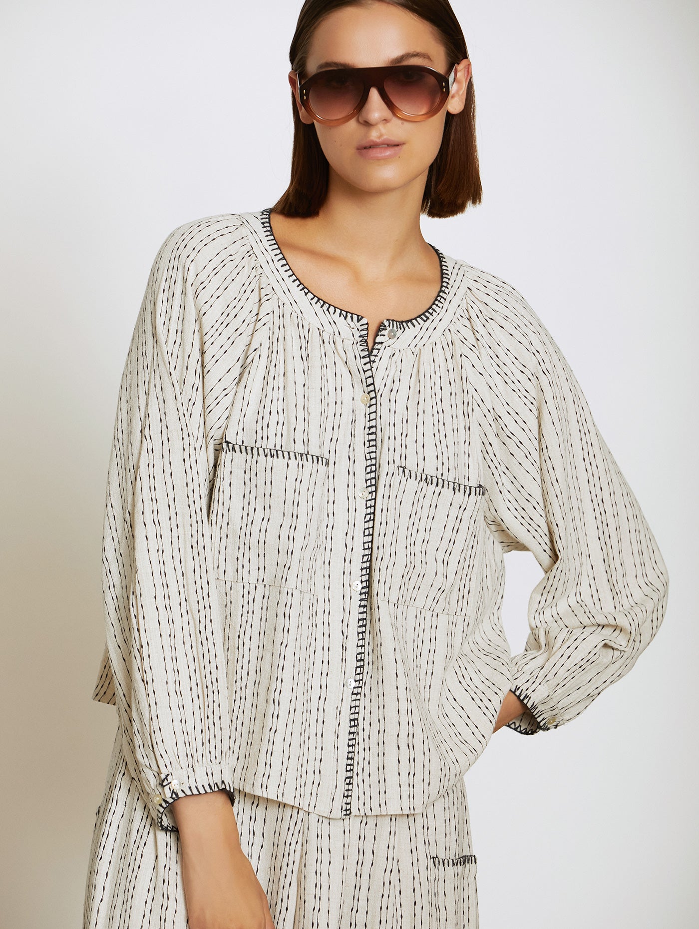 Viscose and linen blend shirt with polka dot print and embroidery detail from Skatie in two colour combinations. This easy to wear blouse also doubles as a jacket. It is super versatile yet classy and elegant. The fit is true to size.