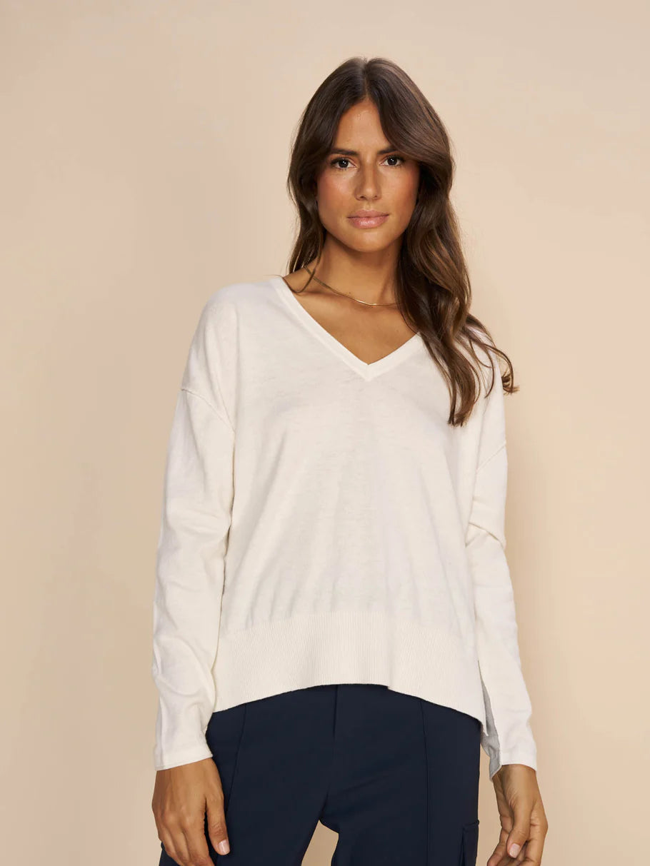 MMTani soft cotton and cashmere V neck knit. Super soft in feel and flattering neckline for a fuller bust. Side splits and longer at the back than the front. Perfect paired with jeans