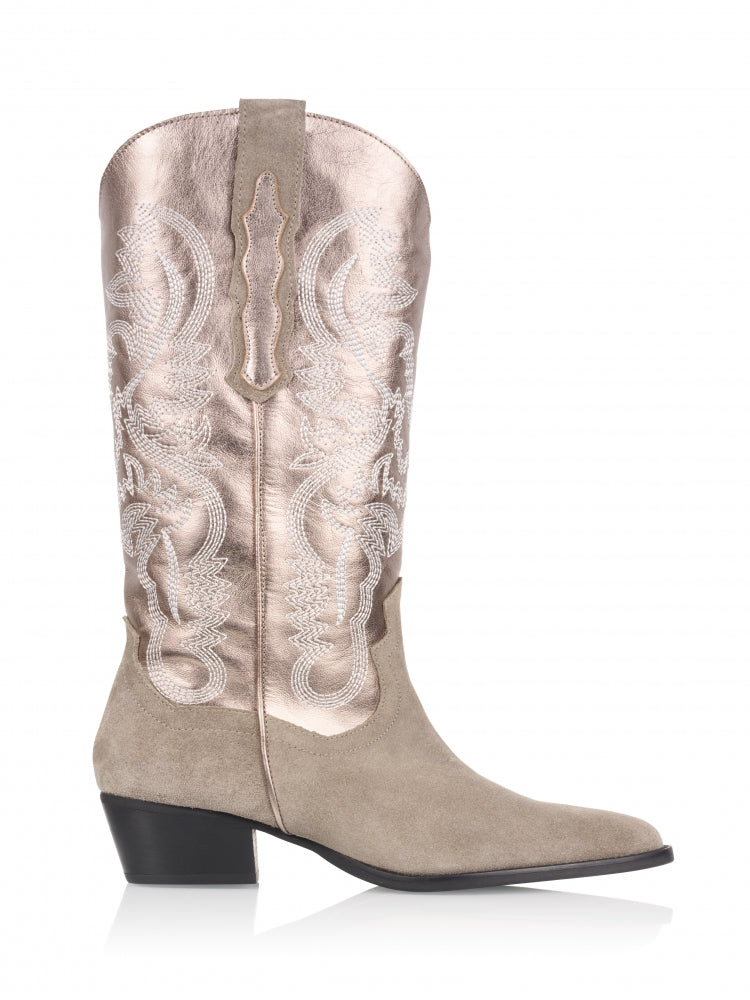 This fabulous western style boot from DWRS is a combination of leather and suede. The western style boot makes a style statement . Complete with pull on tabs this pull on boot is super easy to wear teamed with a dress or with jeans. Made in Portugal from the softest leather and suede.