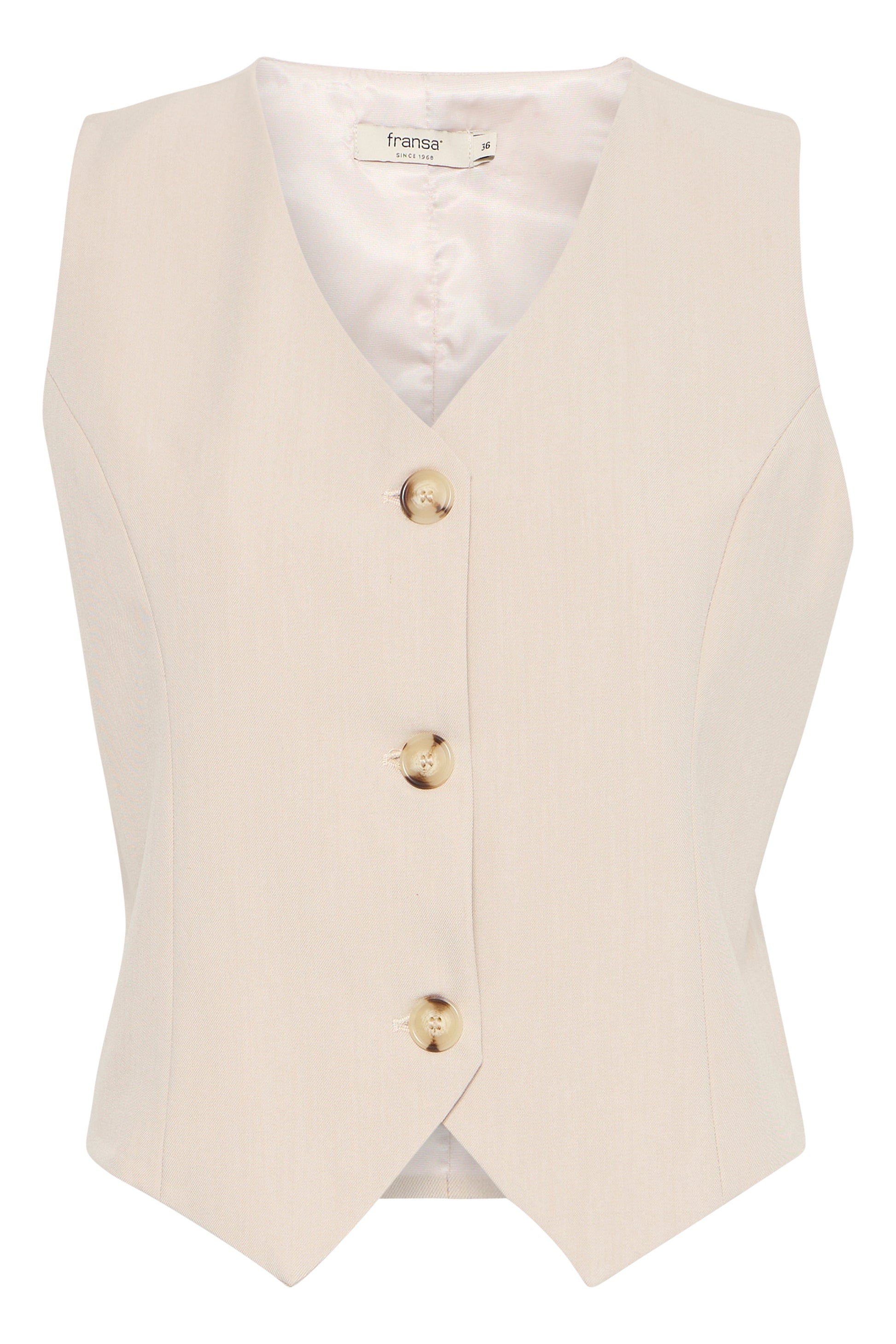 A gorgeous fitted waistcoat from our favourite Danish brand FRANSA. This chic piece is great worn with a wider leg trouser or a full skirt. The V neck flatters a bigger bust and the contrasting buttons add that point of difference. The fit is true to size.