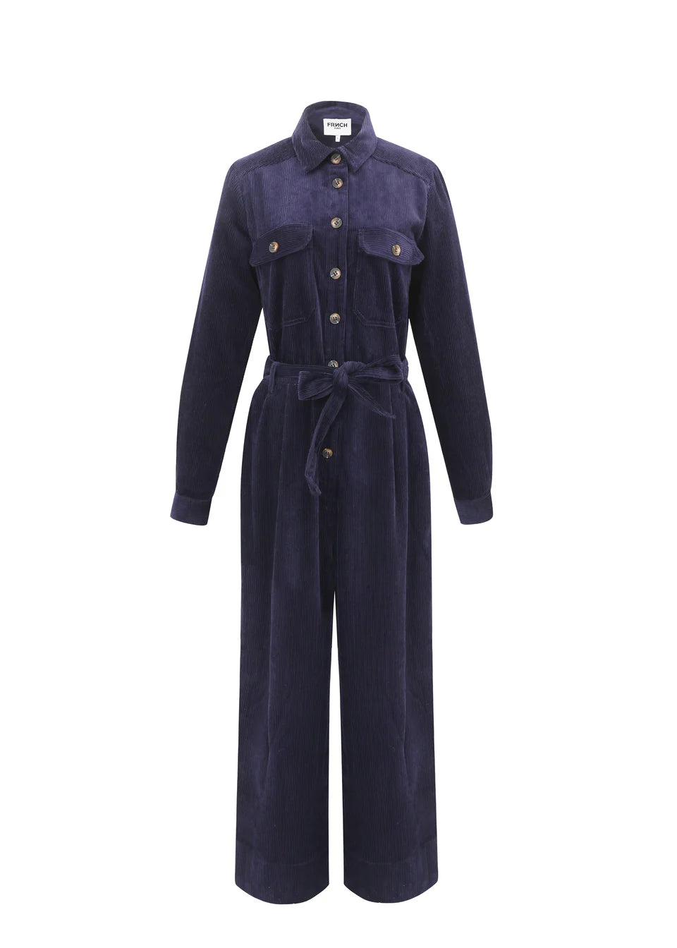 The perfect Winter jumpsuit from Parisian brand FRNCH in a classic navy blue. The fabulous piece in a dark blue corduroy. A both cool and comfortable piece for the autumn and winter. It has a collar, chest and rear pockets with buttons, side pockets and button fastenings to the front. Detachable belt and belt loops. It has wide legs and the inside trouser hems are lined with the cord fabric so they can be turned up with a large turn up or a smaller one to suit your leg length. They can also be worn without 