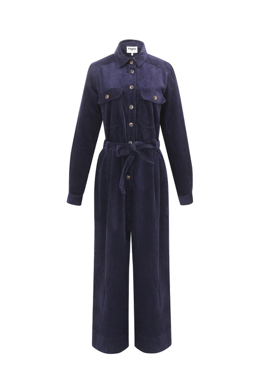 The perfect Winter jumpsuit from Parisian brand FRNCH in a classic navy blue. The fabulous piece in a dark blue corduroy. A both cool and comfortable piece for the autumn and winter. It has a collar, chest and rear pockets with buttons, side pockets and button fastenings to the front. Detachable belt and belt loops. It has wide legs and the inside trouser hems are lined with the cord fabric so they can be turned up with a large turn up or a smaller one to suit your leg length. They can also be worn without 