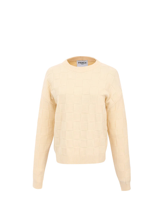 A beautiful knit by French brand FRNCH. The perfect capsule wardrobe piece in a rich neutral Cream colour. The long sleeves have a ribbed cuff. The round neck is ribbed as is the hem. The jumper has a textured feel with square design in different stitches. The fit is true to size.