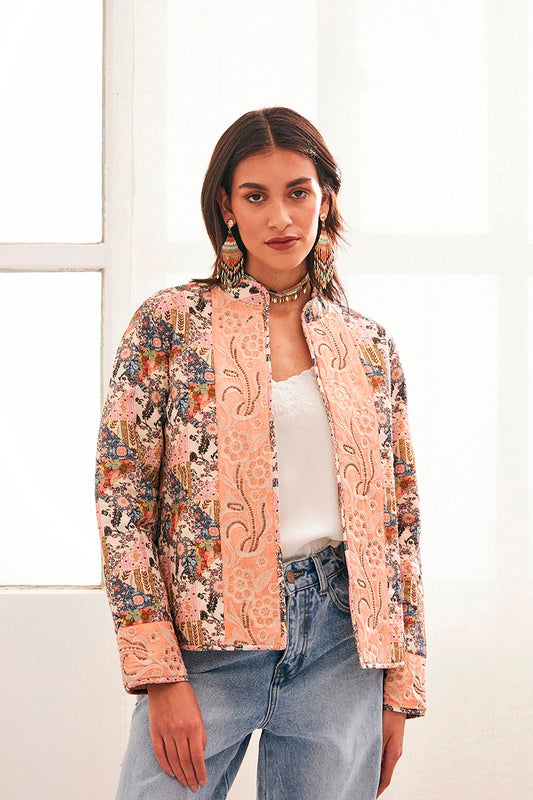 Open bomber jacket from NKN Nekane . This gorgeous piece is perfect worn with a flared blue jean or over a floaty dress. The padded style has contrasting fabric panels with discreet beading down the front and embroidery. The fit is true to size. There is a grandad style collar.