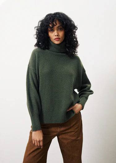 The Ariette jumper from Parisian brand FRNCH is a super cosy over sized piece. Very simple in it's style with a polo neck and long sleeves with a ribbed cuff. The hem is slightly shorter at the front than the back and it has small side splits.