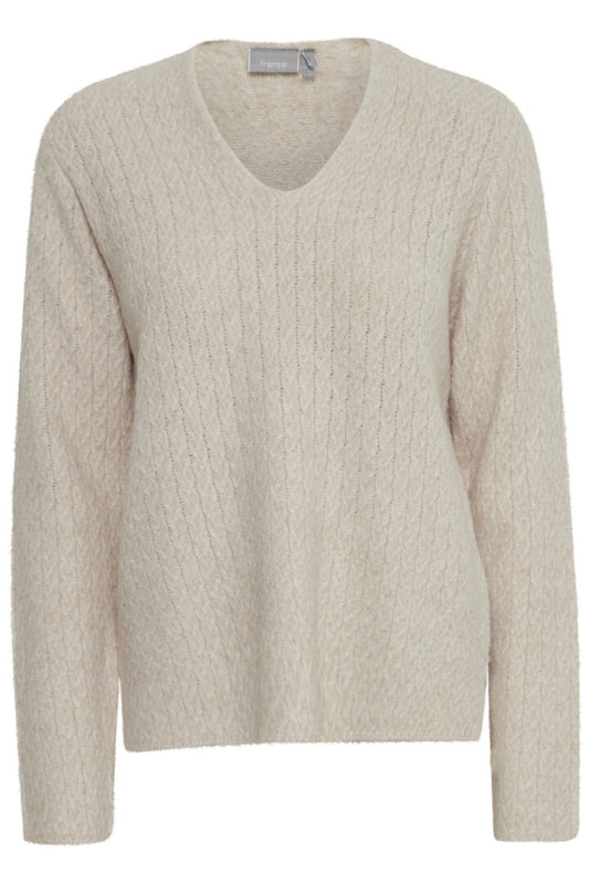 A great textured V neck knit from Scandi brand Fransa, This long sleeved V neck is in a cable knit. The texture is super soft and it has small slits at each side of the hem.