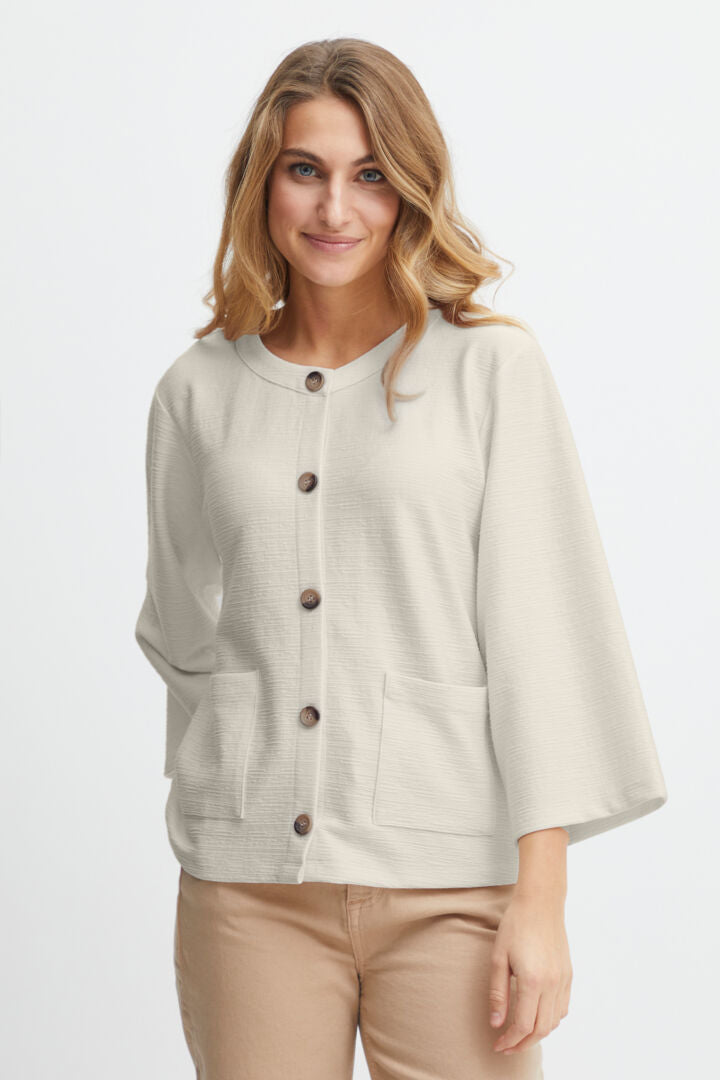 Introducing the Carla 2 Cardigan, a perfect addition to your wardrobe for the upcoming Spring season. This versatile and stylish piece from Fransa, a well-known and loved Scandi brand, comes in a beautiful off white and classic navy. The round neck design features contrasting buttons that run from the neck to the hem, making it both functional and fashionable.