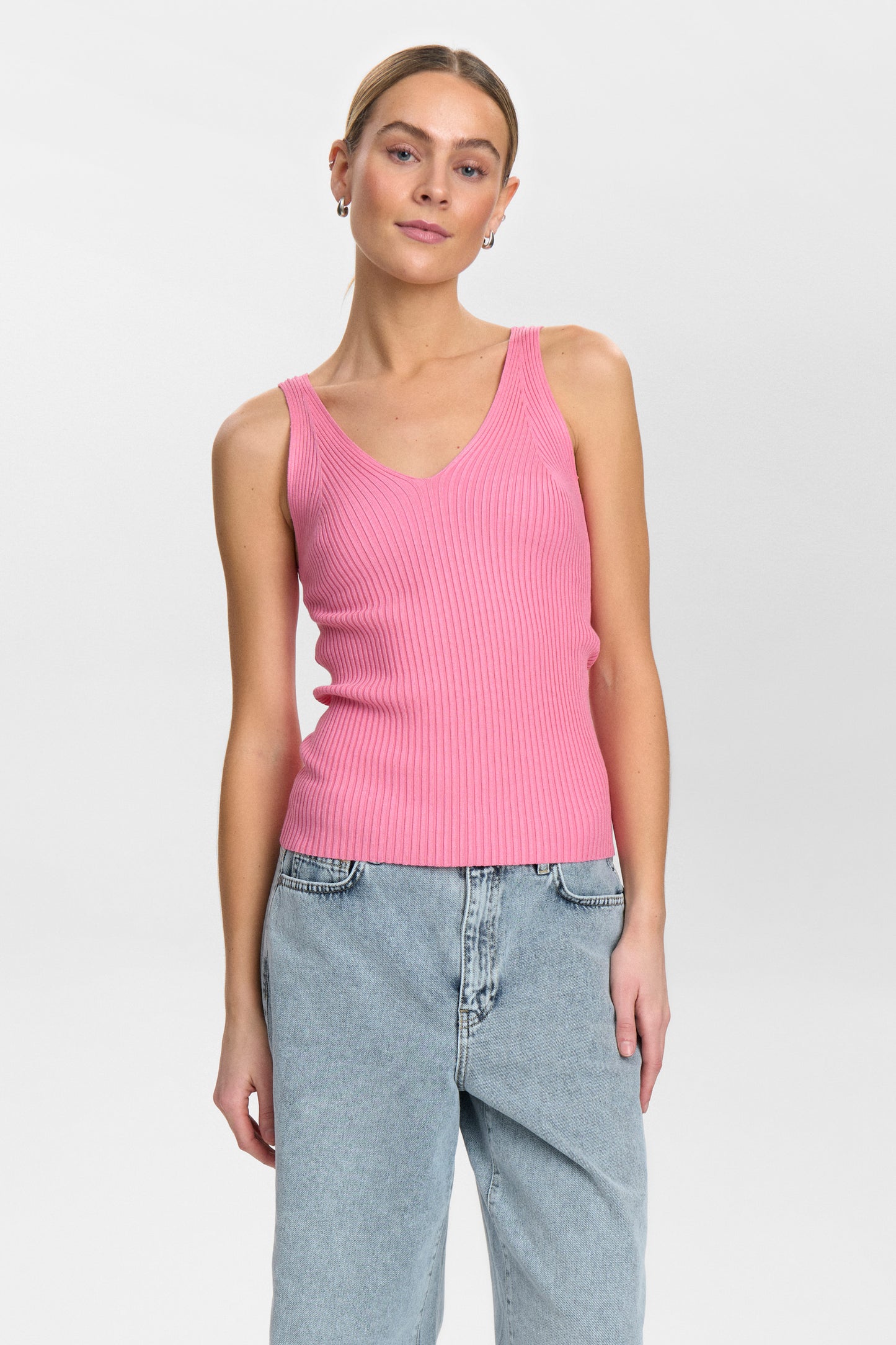 A super soft vest top from our favourite Danish brand NUMPH. The tank top is knitted and ribbed making for a great fit. The fit is true to size.