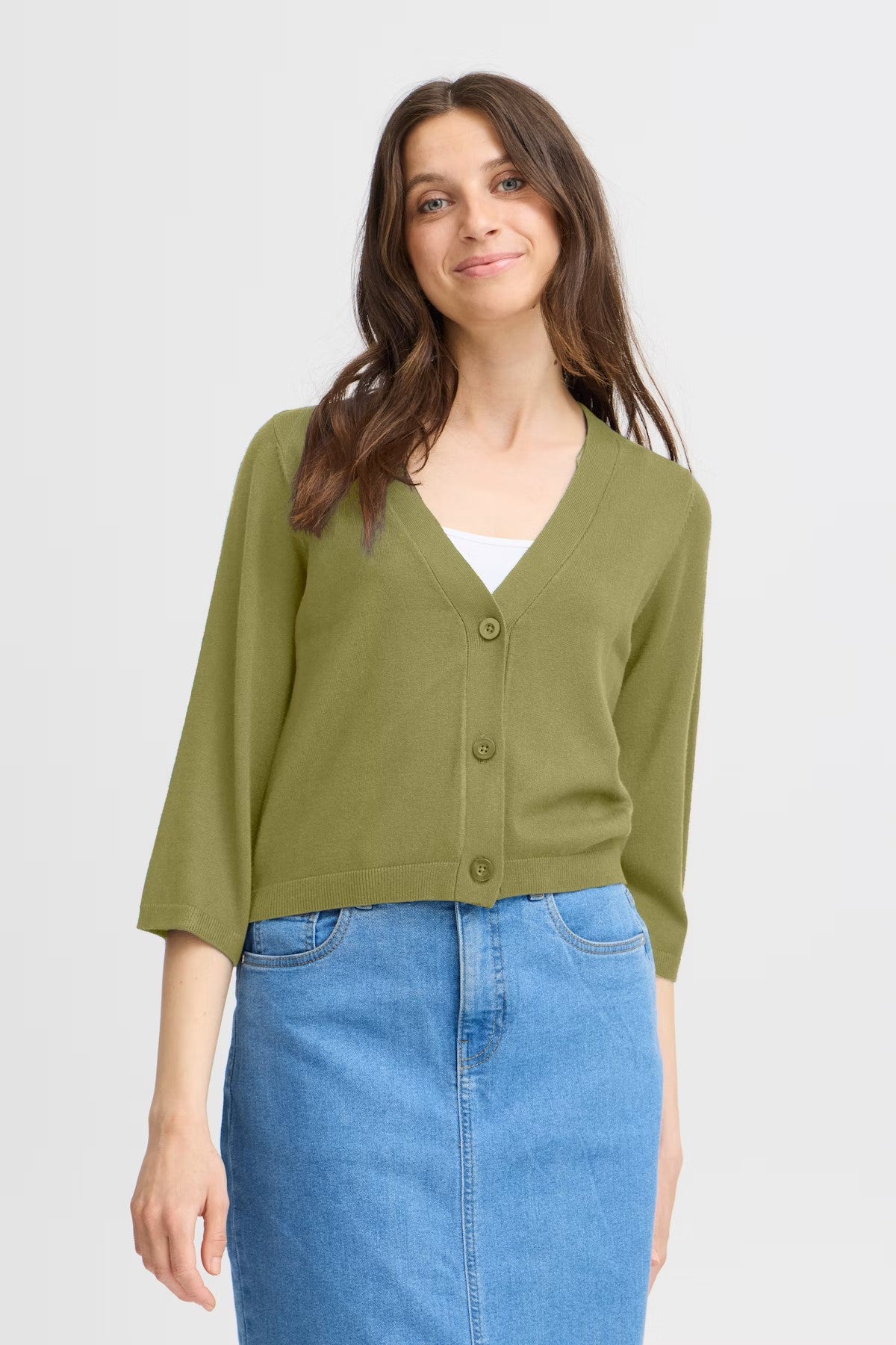 This little cropped cardigan from Scandi brand FRANSA is a complete winner every season. A short style V neck knit with a three quarter sleeve with a split on the ribbed cuff, great worn with a skirt or over a dress for arm coverage. The fit is true to size.