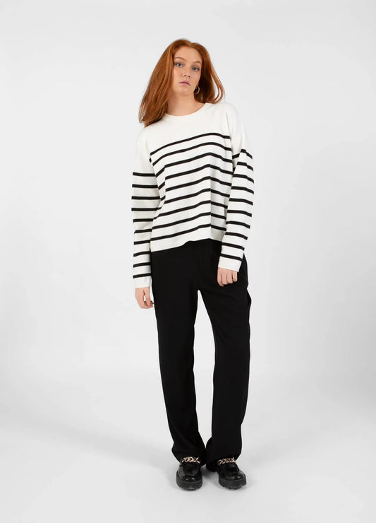 This black and white striped sweater from CC Heart adds a classic touch to your wardrobe. Its feminine open back makes it perfect for both everyday wear and casual occasions. The softest of fabric and non itchy ! Classic stripe.