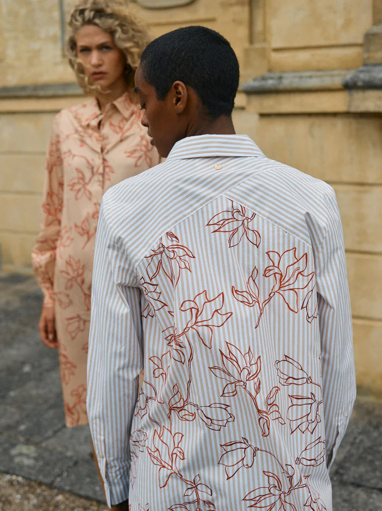 A statement shirt in pin stripe with hand painted floral on the back