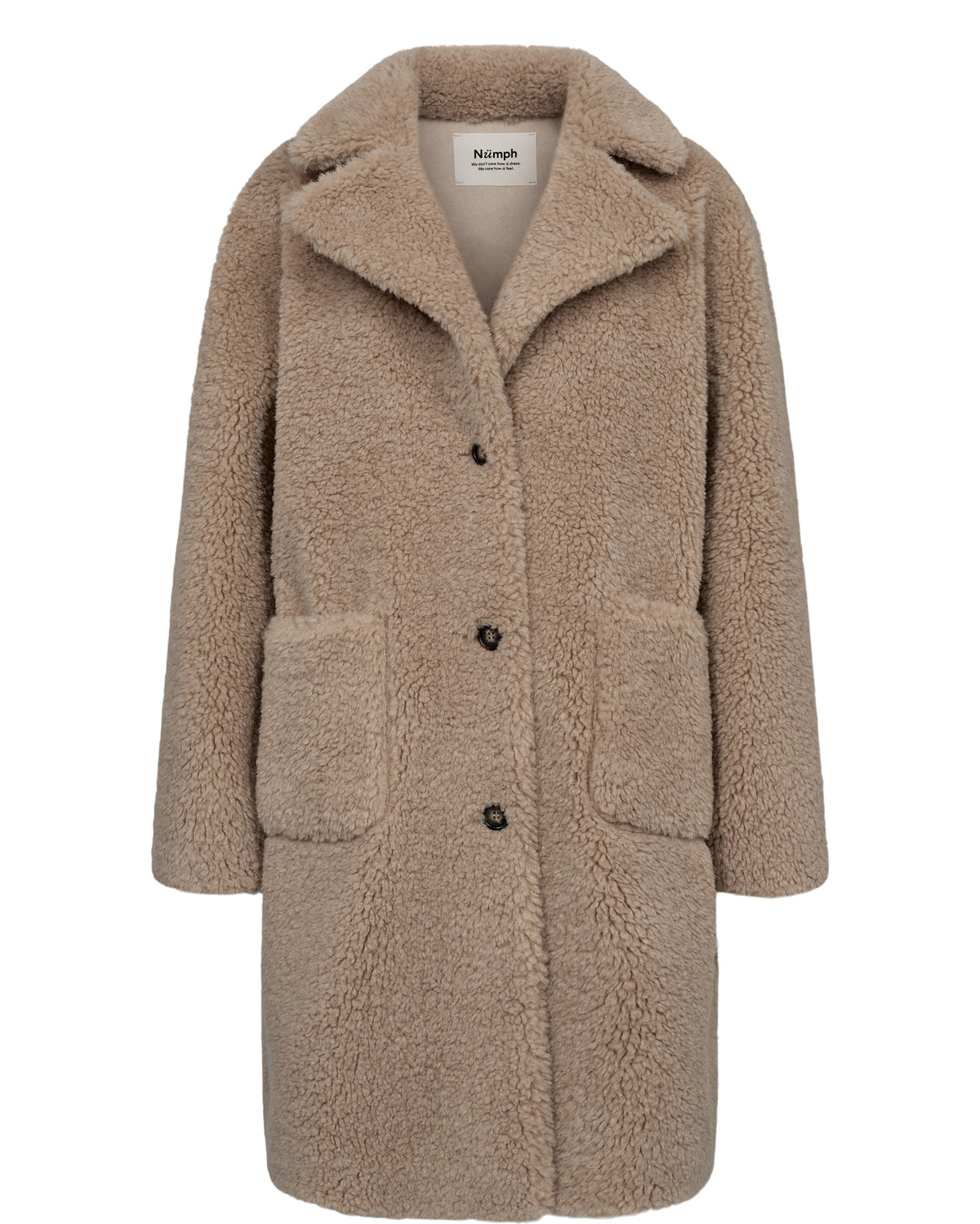 A playful addition to your outerwear collection with its teddy bear design, this reversible coat from Numph has a longline cut and provides you with the versatility of two looks in one. One side is faux suede and the other teddy style fabric. It has front pockets on each side. A fantastic warm coat with a difference.