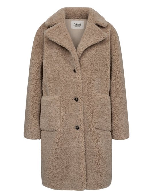 A playful addition to your outerwear collection with its teddy bear design, this reversible coat from Numph has a longline cut and provides you with the versatility of two looks in one. One side is faux suede and the other teddy style fabric. It has front pockets on each side. A fantastic warm coat with a difference.