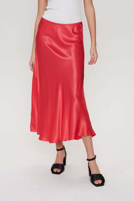 A wardrobe essential from scandi brand Numph. This slip skirt is slightly flared making it much easier and more flattering to wear. An elasticated waist makes it versatile in it's fit. In a thicker fabric it is less flimsy than normal slip style skirts. The fit is true to size.