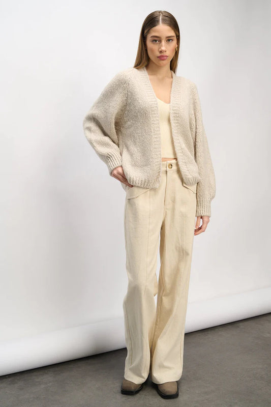 The Fora Knit Cardigan from Noella is a highly sought-after Noella cardigan, available in two stunning colours. It boasts a relaxed and true-to-size fit, making it a must-have addition to your wardrobe. With its timeless design and delicate balloon sleeves, this knit cardigan exudes femininity. 