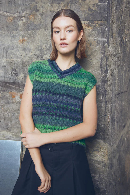 This heavier knit from Noella is a beautiful piece for the new season ahead. A short and boxy piece with a V neck in a green and navy combination. Wear with a skirt or a wide leg jean for that cool look. The fit is true to size.