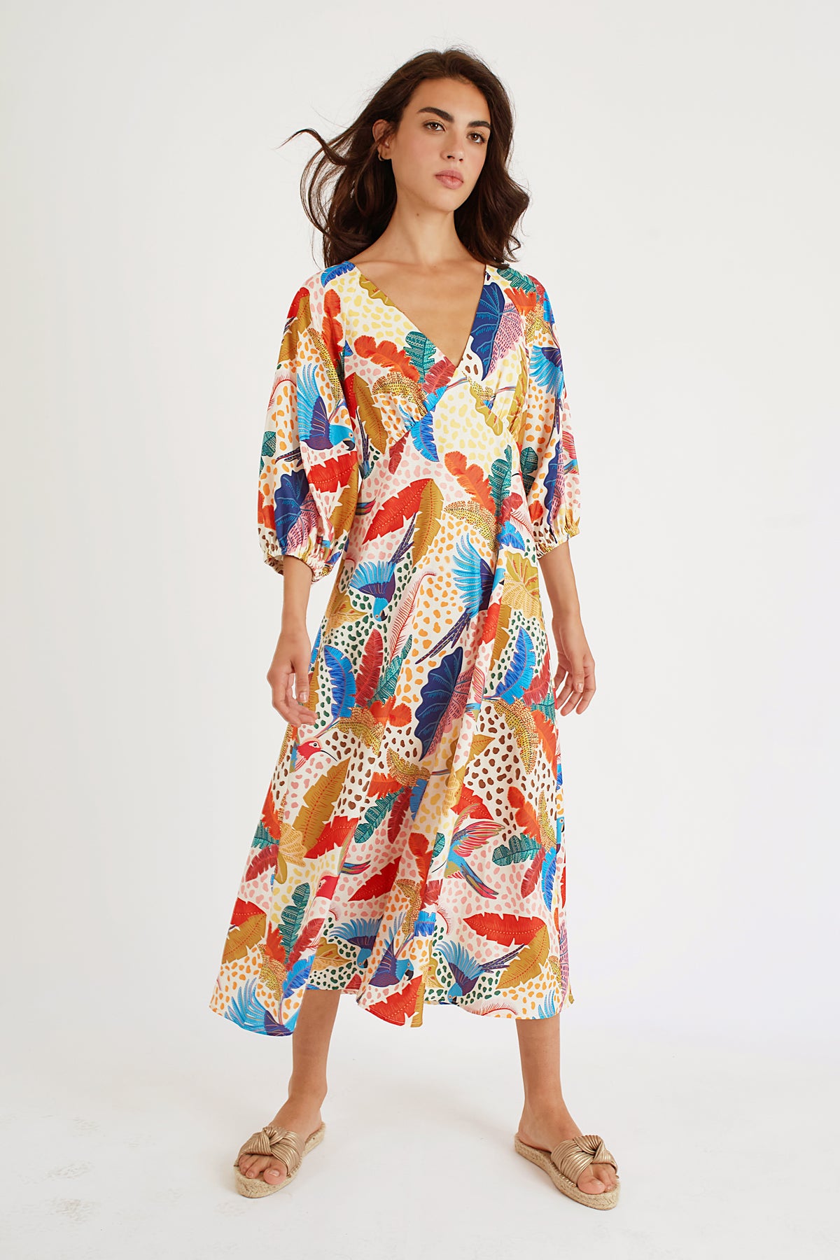 The Gloria in our multicolour Pretty Boy print from Traffic People is a gorgeous midi dress with a deep V-neck with gathering on the bust, beautiful 3/4 sleeves and elasticated cuffs. The stunning bold fabric makes it the perfect statement piece for Spring/Summer.