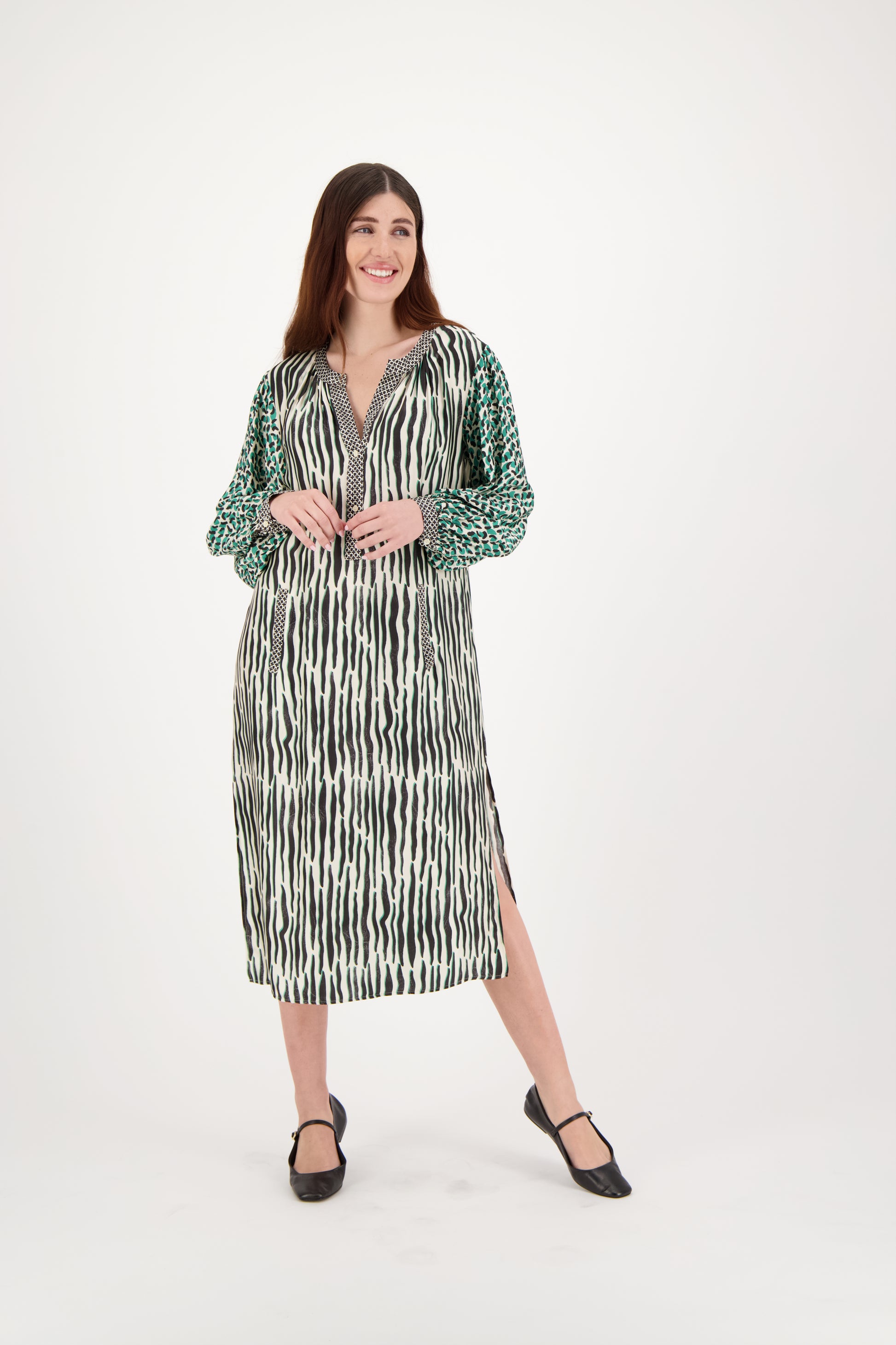 Elevate your style with the Hanna Placket Dress by Me369. Made from 100% viscose, this mid-length dress features long sleeves and a flattering V-neck. The contrast sleeve pattern adds a unique touch, making it perfect for both casual and special occasions. Pair with boots or heels for a sophisticated, on-trend look.