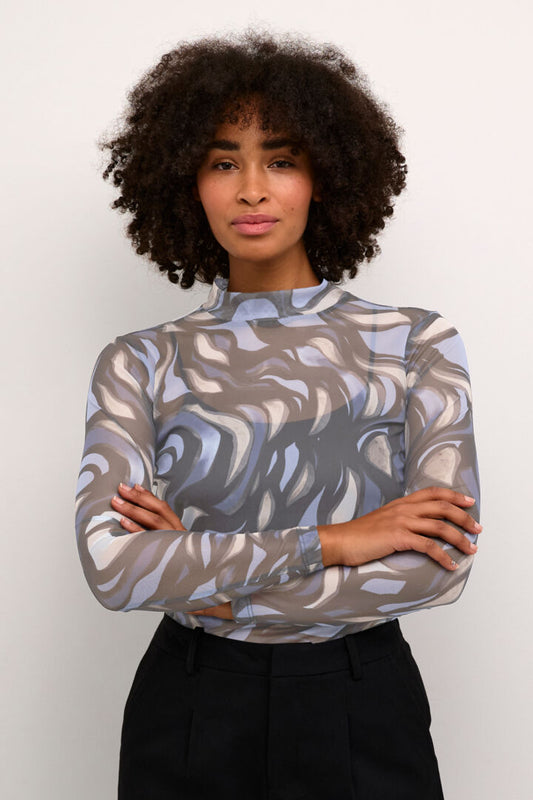 A super sheer top from Scandi brand KAFFE in and abstract multi coloured print of blues, greys and black. The colour in the image is lighter than the actual fabric colour. The fitted long sleeves top has a high neck and pulls over the head. Wear with a cami underneath if necessary. This is a fitted piece.