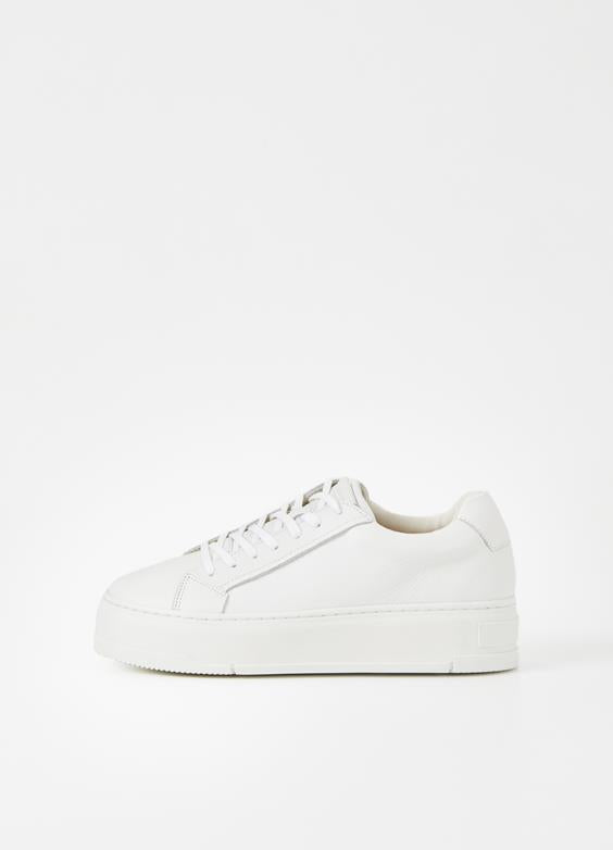 Add a fresh take on the statement platform sneakers with these new Judy from Vagabond. The low-top silhouette and chunky rubber sole will add a muted twist to any dressy ensemble this season. The minimalistic upper is made from black or white leather set on 40mm white soles for a contrasting look. Details include lace-up closure and padded collars for a comfortable wear.