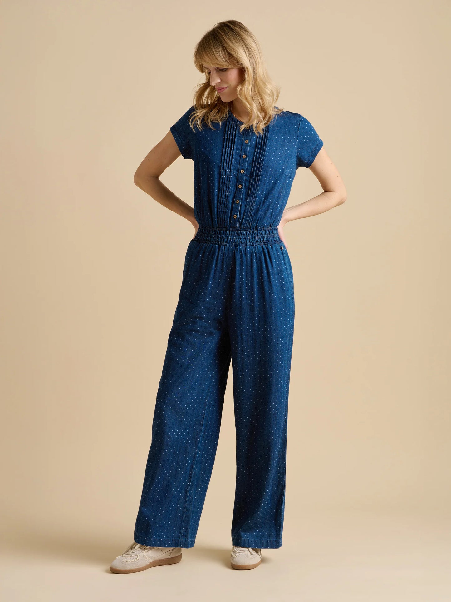 Polka dots with a denim twist from BRAKEBURN, what’s not to love? This denim wash jumpsuit features a subtle dot pattern, capped sleeves, and an elasticated waist that offers just the right amount of structure. Its easy-going fit makes it perfect for everything from running errands to weekend picnics.