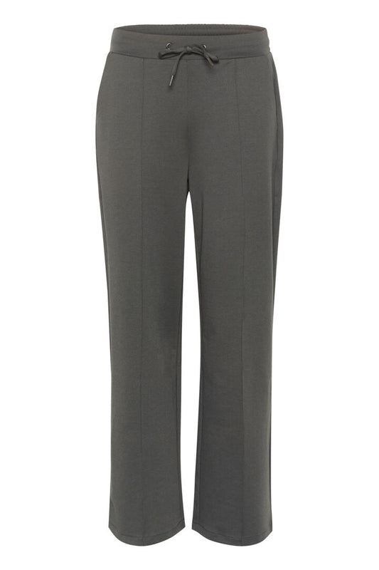 A great jogger style pull on pant by Scandi brand KAFFE. These super versatile pants are perfect for every day wear. Wear simply with a T shirt or add a chunky knit for a cool look. These also look great with the matching jersey blazer as workwear. The fit is true to size. They have a half elasticated waist with a pull cord at the waist. There is a stitched seem down the front of each leg. There are slanted pockets at the front and faux pockets at the back.