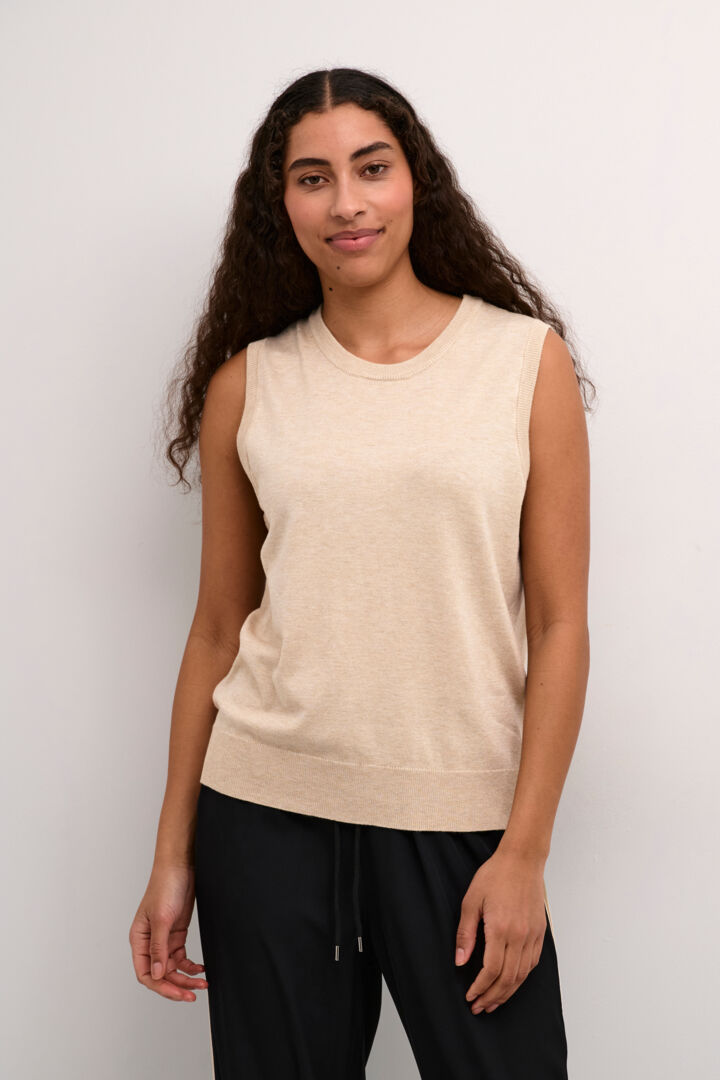 This great slipover knit/ Tank from Scandi brand Kaffe is a great piece worn on it's own now or layered later over a shirt or under a long cardigan. Super versatile and soft to the touch. In a classic neutral colour it can't be dressed up or worn more casually. It is sleeveless and has ribbed armholes and hem. The fit is true to size.