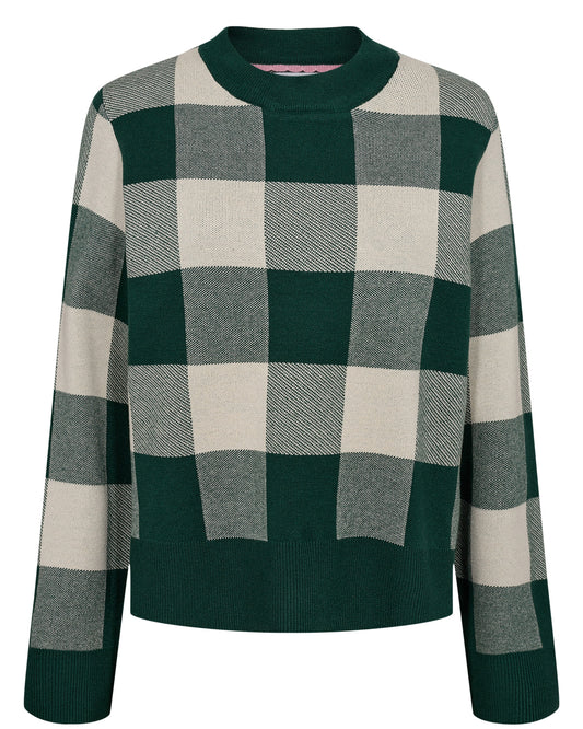 This cozy pullover from Numph is a must-have for those who appreciate a classic with a twist. The garment features a bold, large-scale check pattern in contrasting shades of deep forest green and soft cream or black and cream, creating an eye-catching yet sophisticated look. It’s crafted from a plush knit fabric that promises warmth and comfort, making it perfect for chilly days. The pullover has a relaxed fit with dropped shoulders