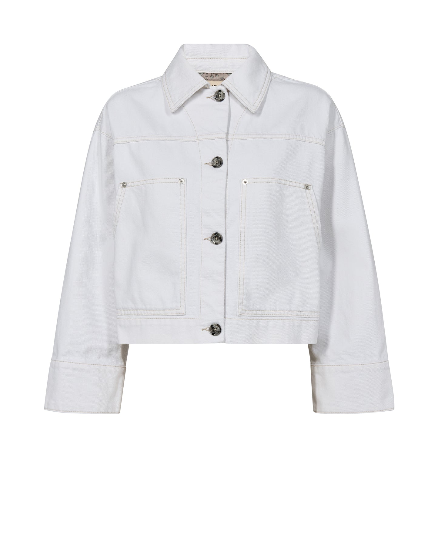 A super stylish white boxy denim style jacket from Scandi brand MOS MOSH . With a shirt style collar and contrasting buttons to fasten this jacket has that point of difference. It has a three quarter sleeve with a wide cuff which is lined with a quirky lining. There are large patch pockets at the front and a half elasticated waist at the back for a great fit.