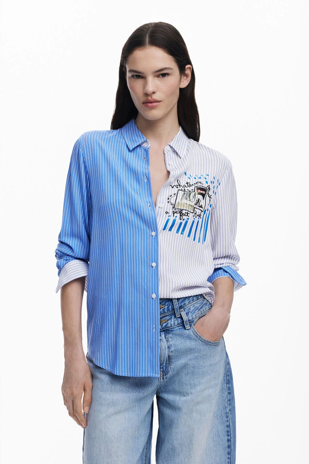 Two-tone shirt, half and half from DESIGUAL, with vertical stripes and patched design on the chest. Long sleeves and shirt collar. The statement piece is perfect with denim and the fit is true to size.