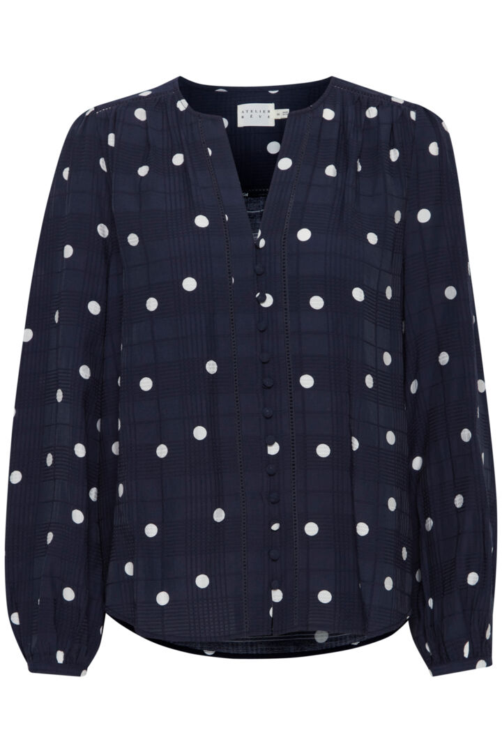 The beautiful Salina blouse by Atelier Reve "fashion house of dreams" is a must have piece for any capsule wardrobe. The stylish navy and white polka dot print works really well for work with a smart blazer or casually with a great pair of jeans.&nbsp; Collarless with a notch neck it flatters a bigger bust and the covered buttons add that little bit of lux to this piece. 