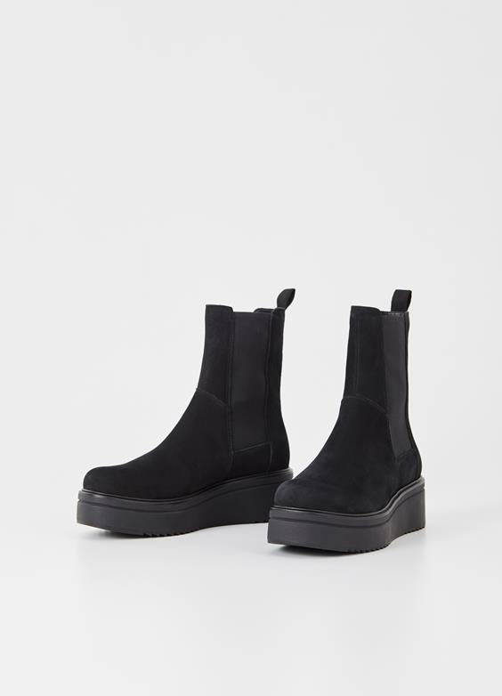 Tara is the platform Chelsea boots with an updated silhouette from Vagabond. The style is crafted in black nubuck featuring elastic side panels, rounded toes and pull-on tabs. The contrast-coloured platform outsoles measure 55 mm. Details include pull-on tabs.