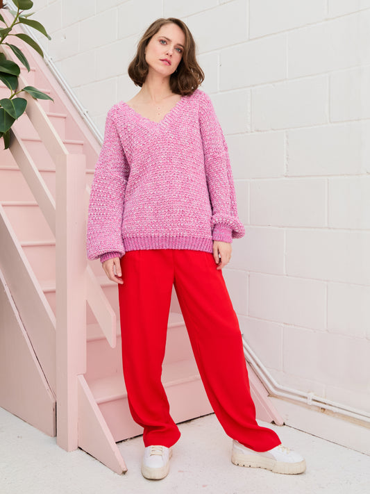 Brighten up those grey days with Zohar from CARA & THE SKY. The oversized v neck jumper has an all-over chunky moss stitch that reveals the unique twist of pink and lilac tones in the yarn, adding visual texture and creating depth that is enhanced with the bold pink cuff and hem.

The vibrant hues of the oversized v neck jumper create a gorgeous contrast against white or black trousers, keeping Zohar centre-stage. 