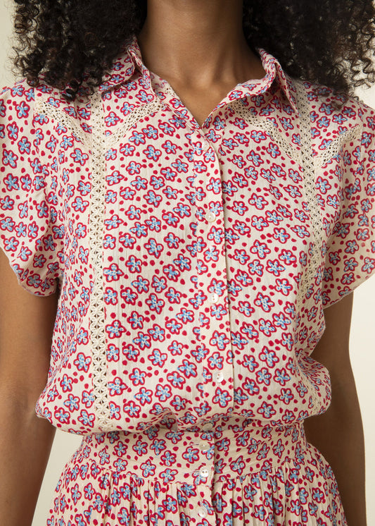Delicate printed blouse in summer floral red and blue print on a cream coloured background