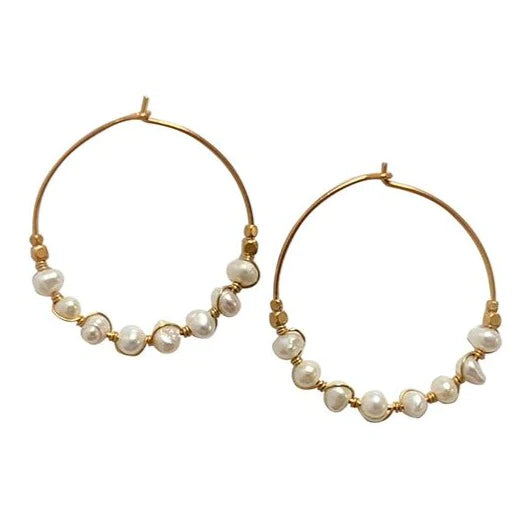 Sparkle and shine with our effortlessly chic hoop earrings. From day to night, hoop earrings are versatile for any occasion. Ours are handmade from Gold Filled Wire with elegant freshwater pearls